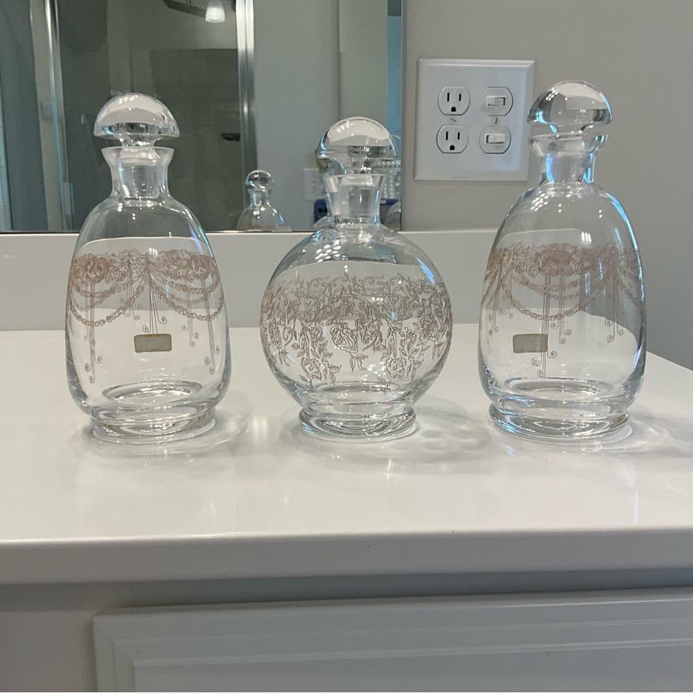 A set of 3 hand made bohemian crystal bottles etched in gold
